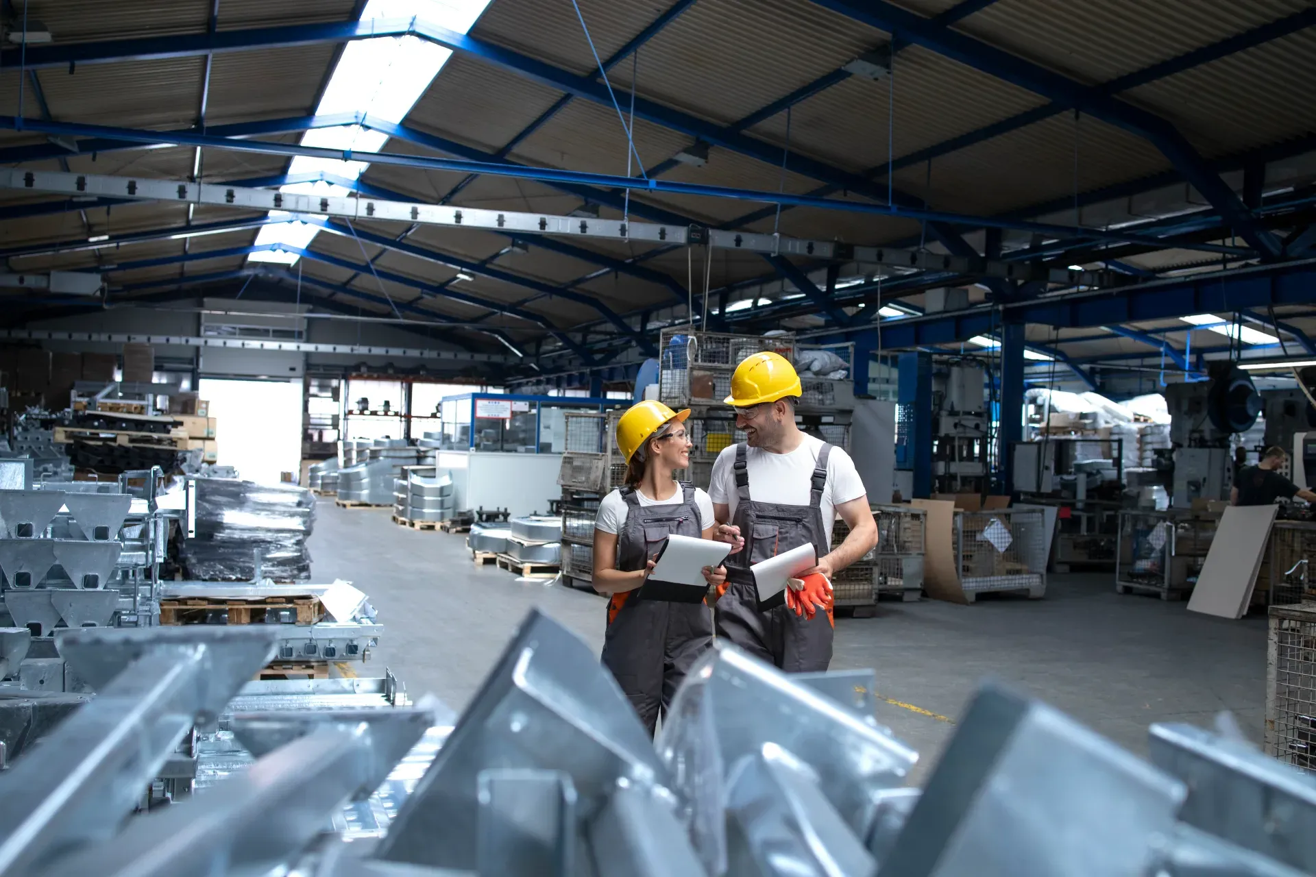 Quality team reviewing output in a production hall