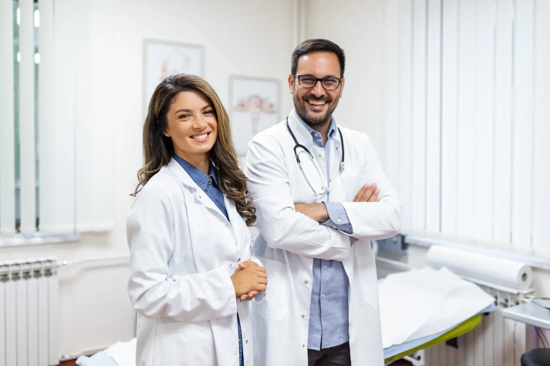 Smiling medical staff standing together inside a modern hospital